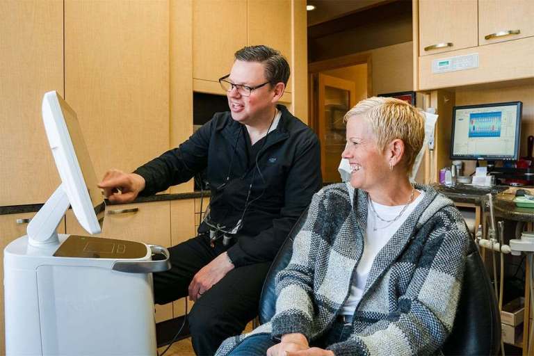 patient smiling while talking with Dr. Sorge